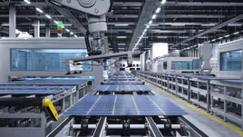 Solar panels being assembled in a manufacturing facility