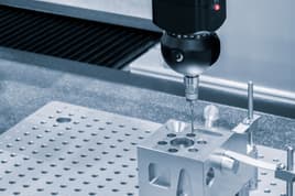 CNC Machining tool engraving on a metal part