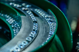 Machine organizing die cast metal nuts